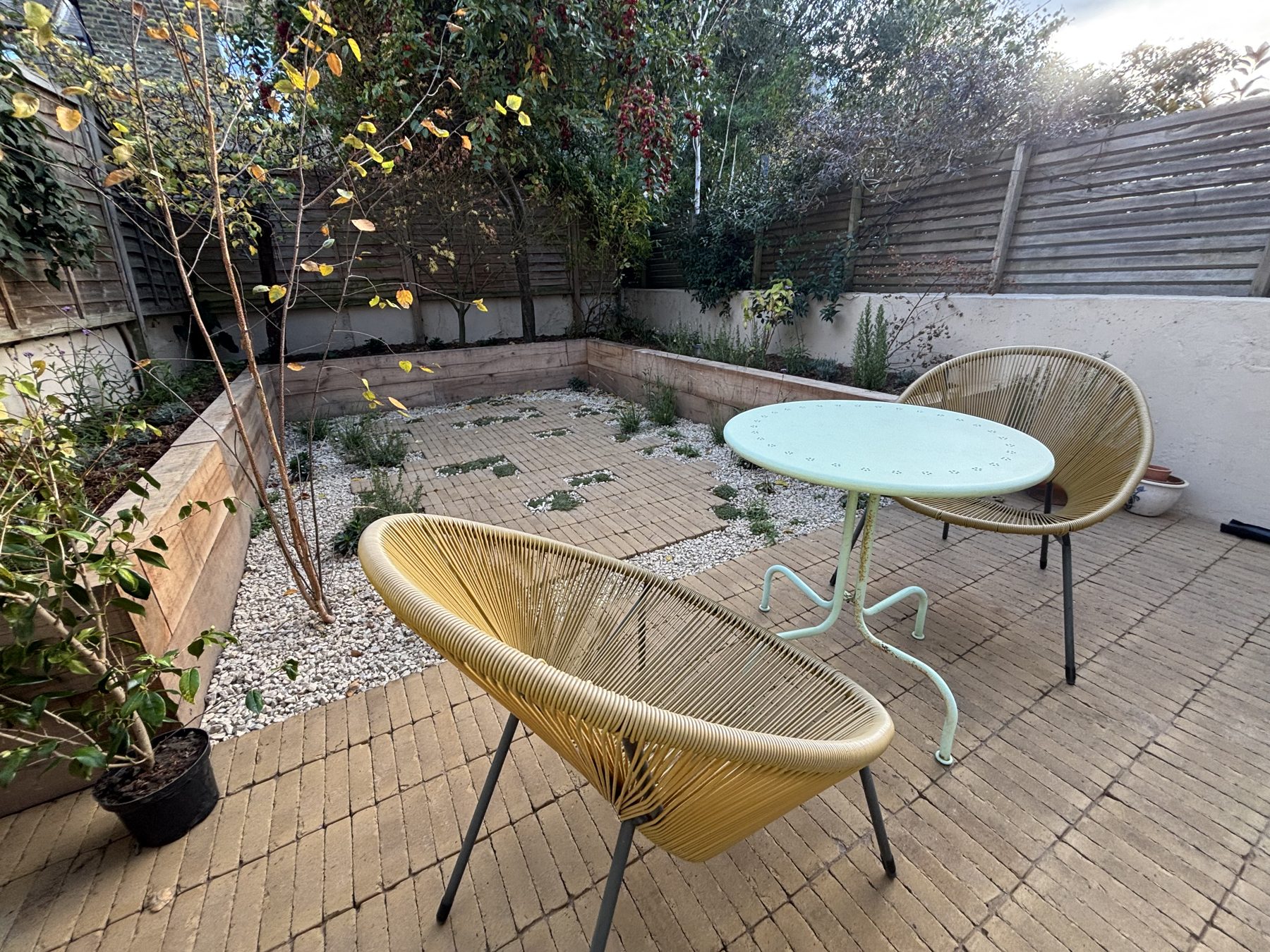 Seating on brick paving with planted pockets